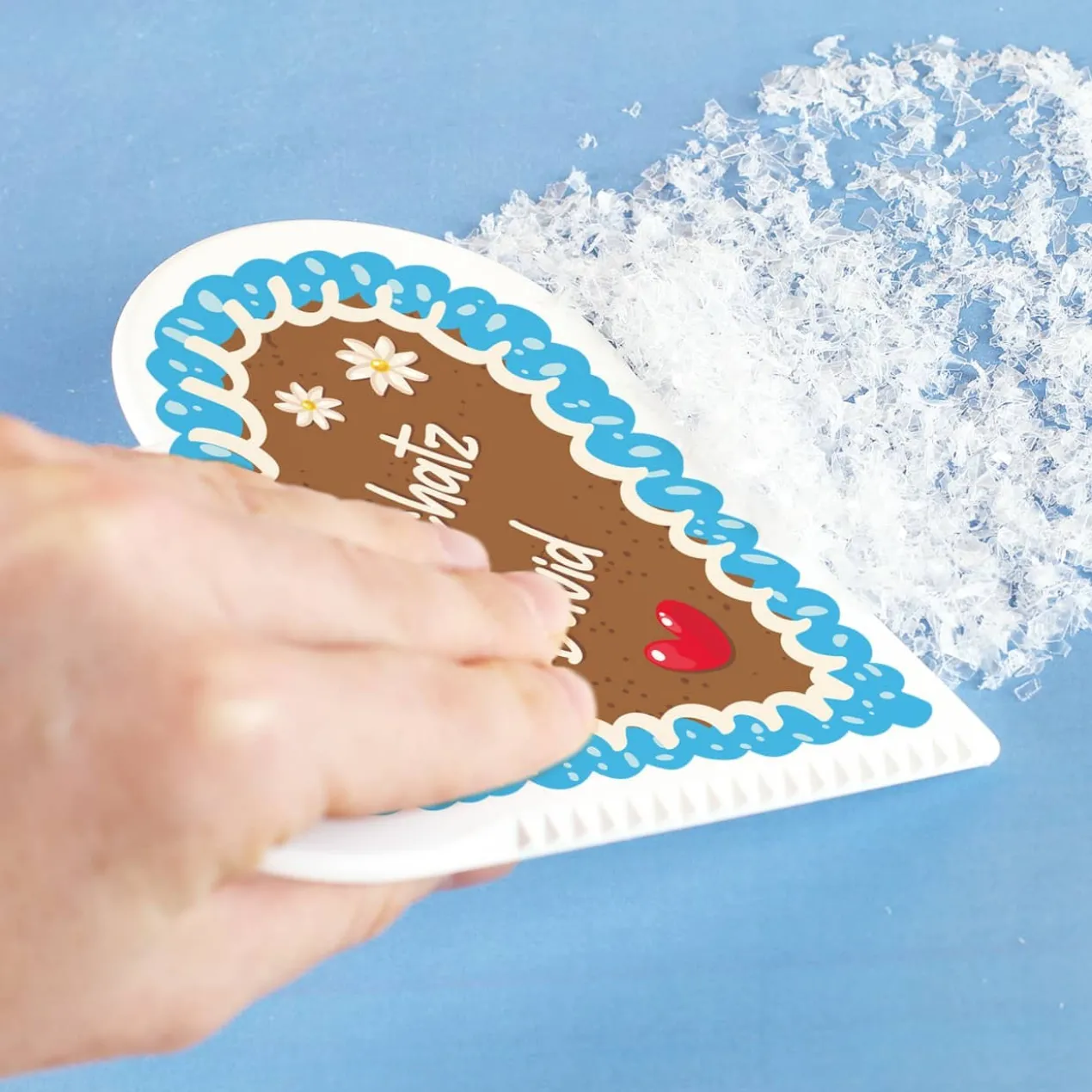 Eiskratzer in Herzform mit Lebkuchenmotiv