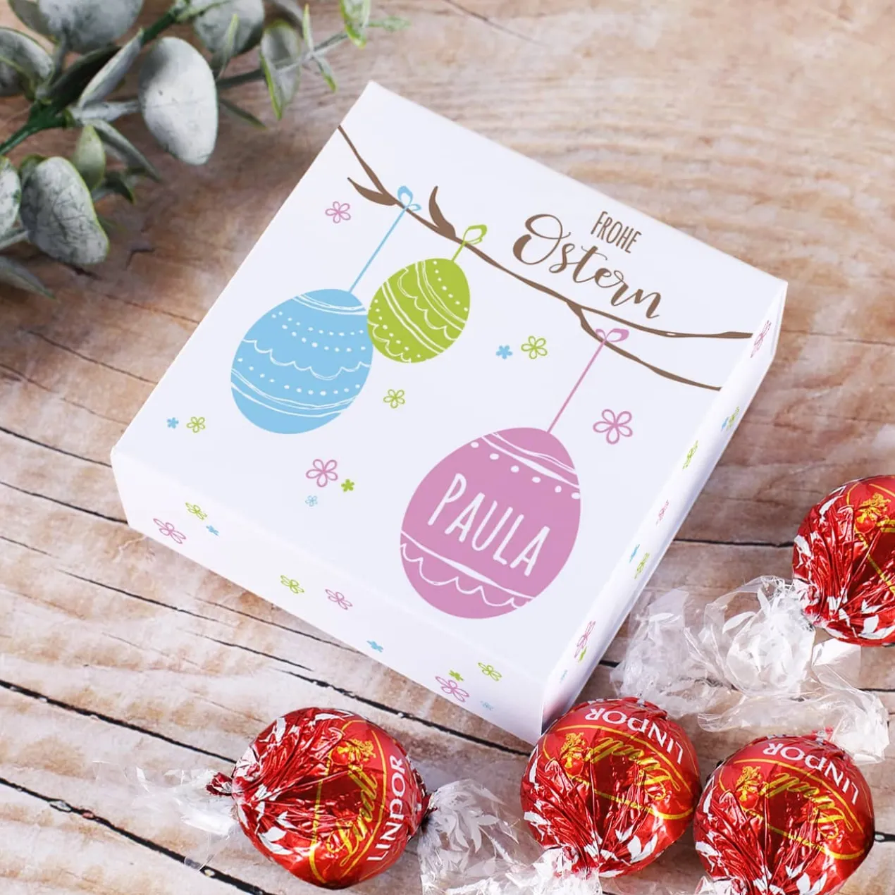 Frohe Ostern - Faltschachtel mit 4 Lindorkugeln und Ihrem Wunschnamen