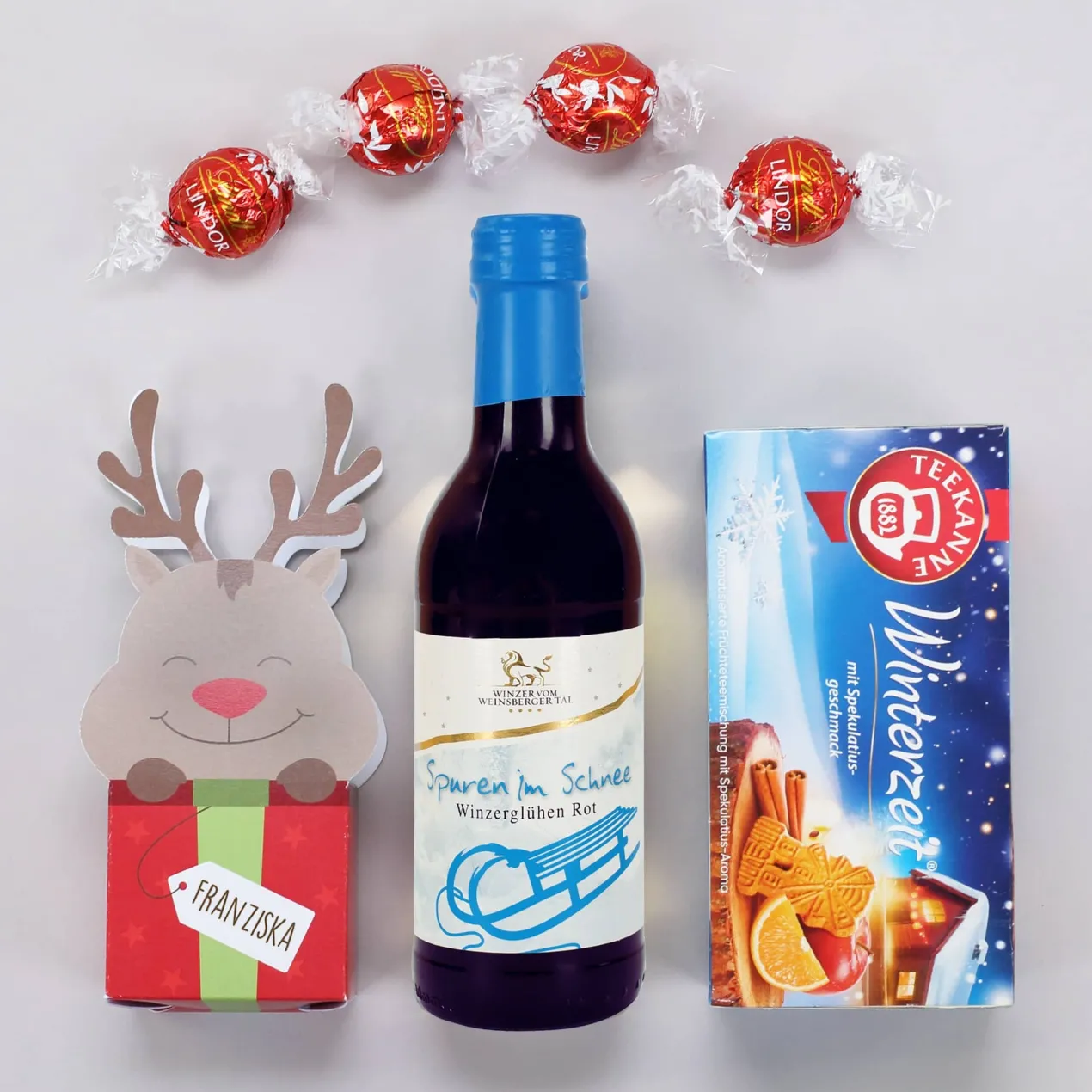 Geschenkkorb mit Lindorkugeln, Tee und Glühwein zu Weihnachten