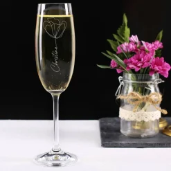 Graviertes Sektglas mit moderner Blüte und Ihrem Wunschnamen