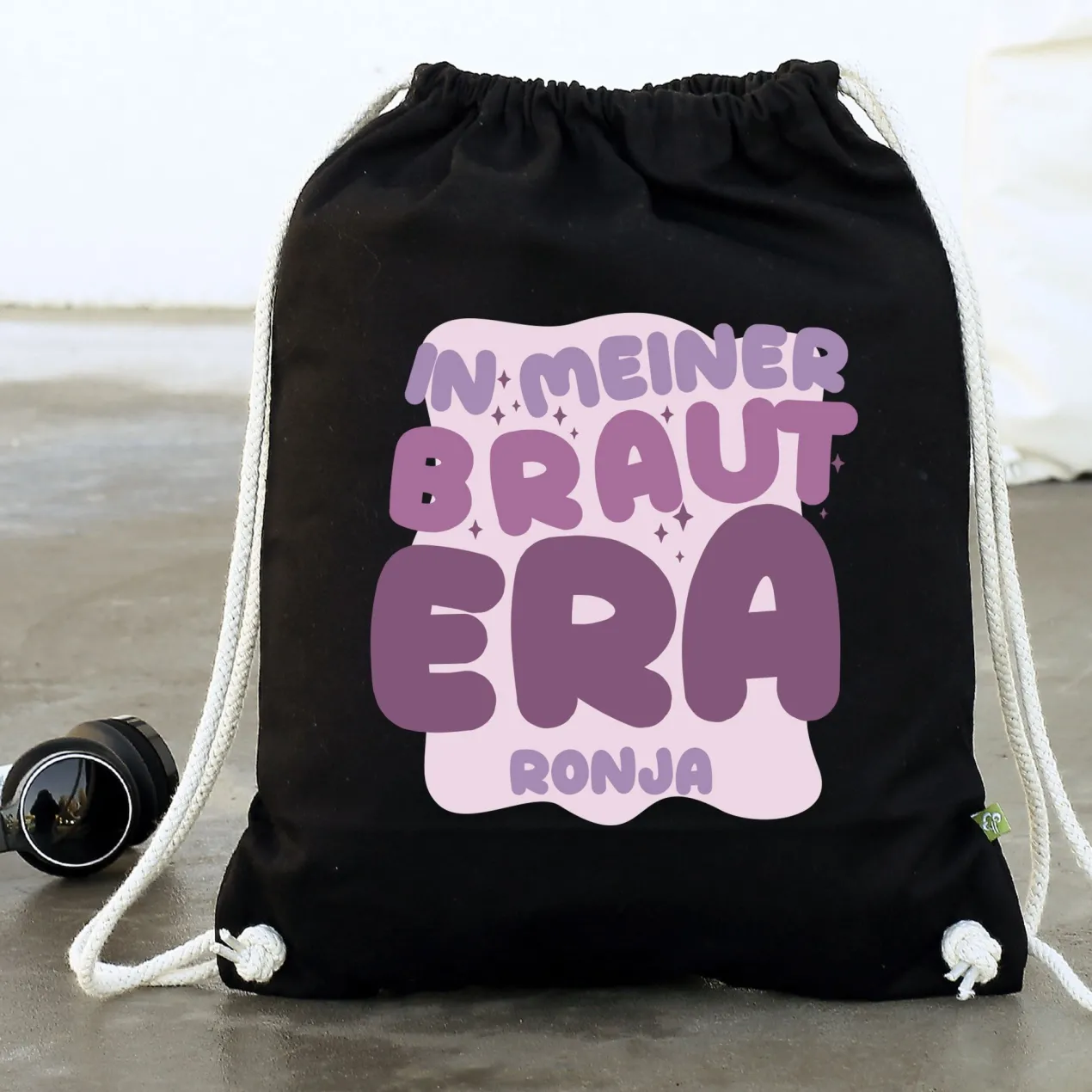 JGA Baumwoll-Rucksack mit Wunschname für die Braut-to-be | Schwarz & Natur