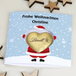 Karte mit Weihnachtsdruck und Lindt Schokoherz