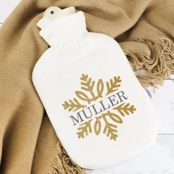 Kuschelige Wärmflasche mit Schneeflocke in Goldoptik und Name bedruckt