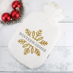 Kuschelige Wärmflasche mit Schneeflocke in Goldoptik und Name bedruckt