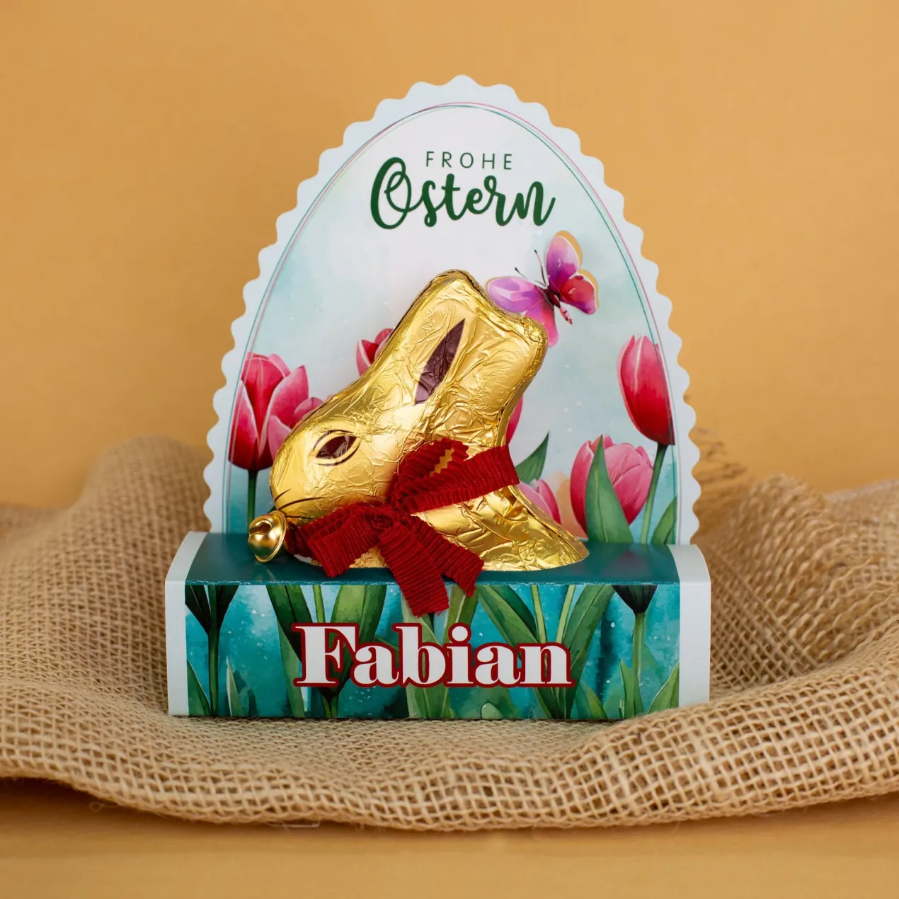 Lindt Goldhase in personalisierter Osterverpackung mit Wunschname "Frohe Ostern"