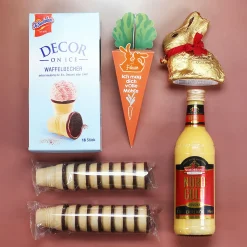 Oster Geschenkset im Holzkorb 'Frohe Ostern' mit personalisierter Möhre, Eierlikör & Lindt Schokolade