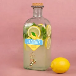Personalisierter Getränkespender aus Glas mit Zitrone Motiv und Hahn | 2L Spender für Limonade & Saft