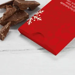 Süße Weihnachtsgrüße gedruckt auf einer Tafel Schokolade