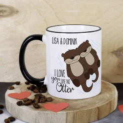 Tasse mit niedlichem Otterpaar