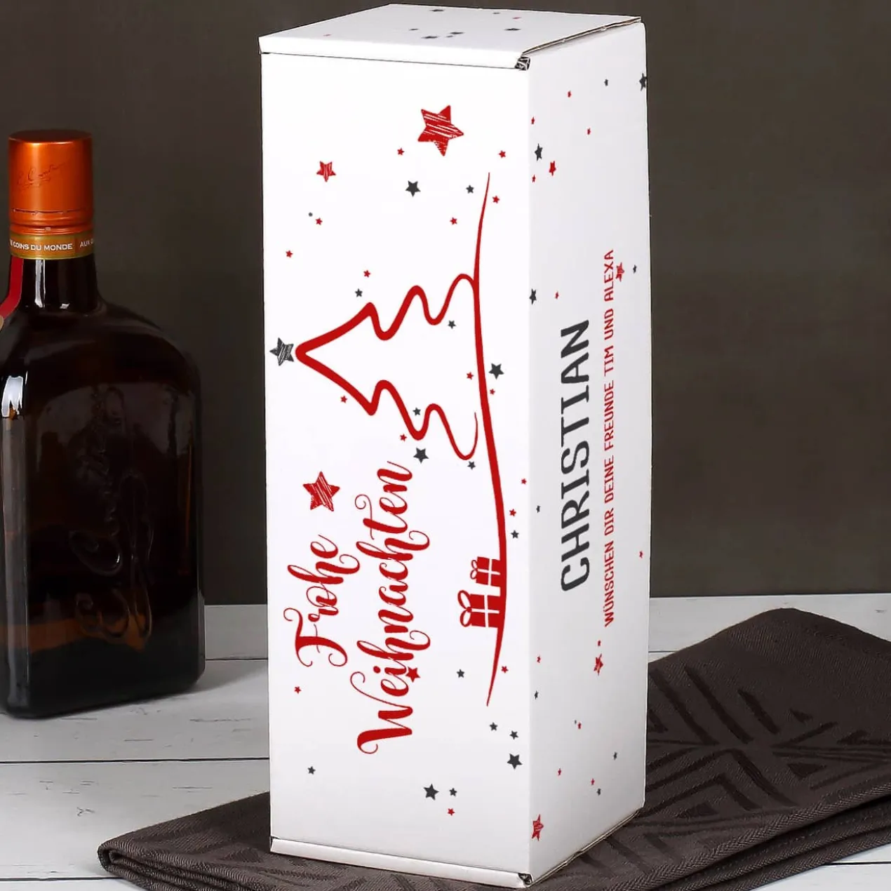 weihnachtliche Pappbox mit Ardbeg Mini Flasche und graviertem Whiskyglas