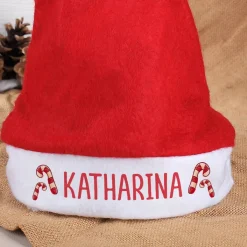 Weihnachtsmütze mit Zuckerstangen und Ihrem Namen bedruckt