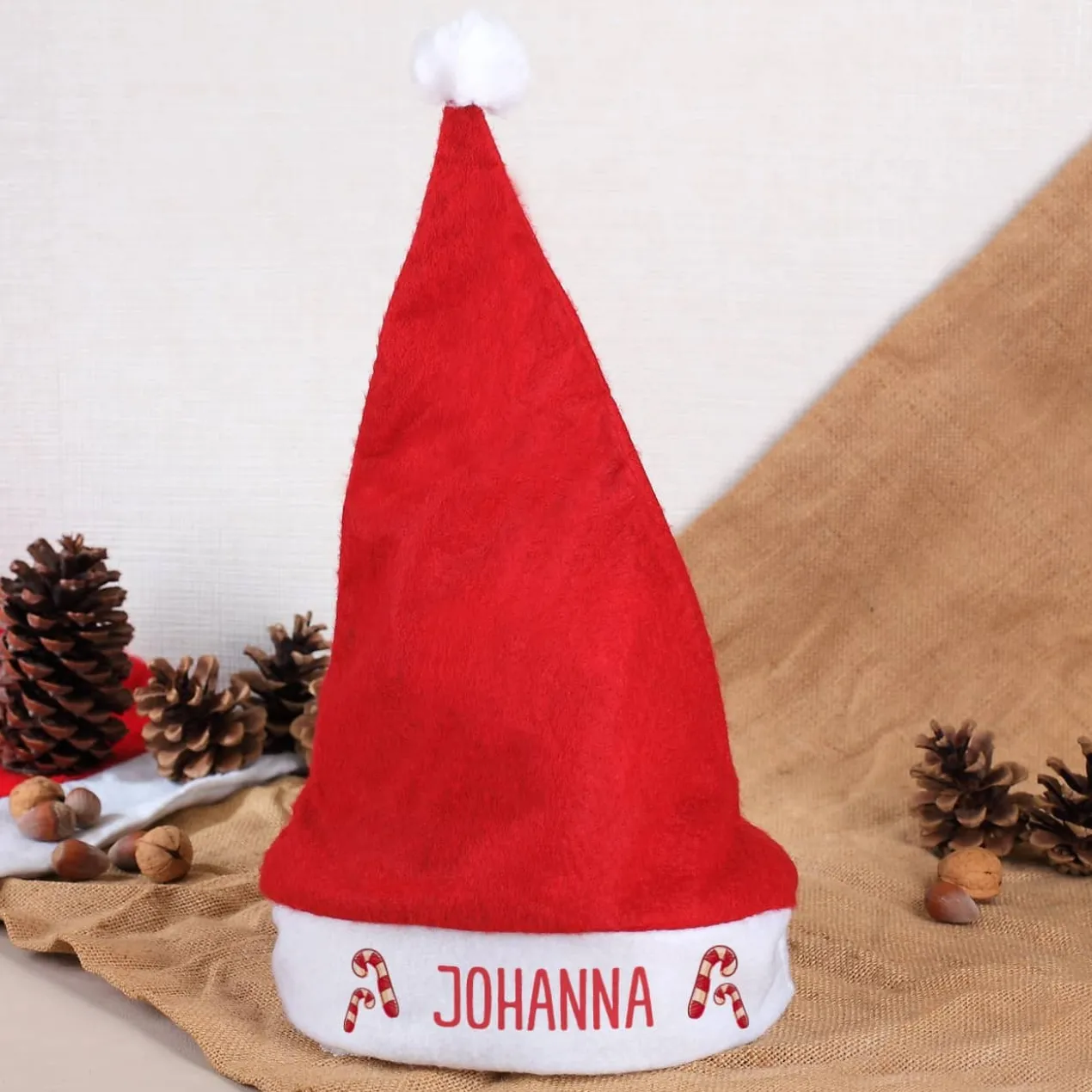 Weihnachtsmütze mit Zuckerstangen und Ihrem Namen bedruckt