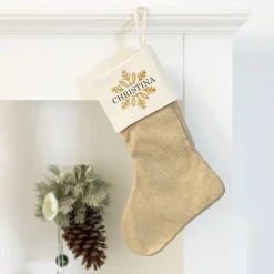 Weihnachtssocke mit goldenem Schneeflockenmotiv und Name bedruckt